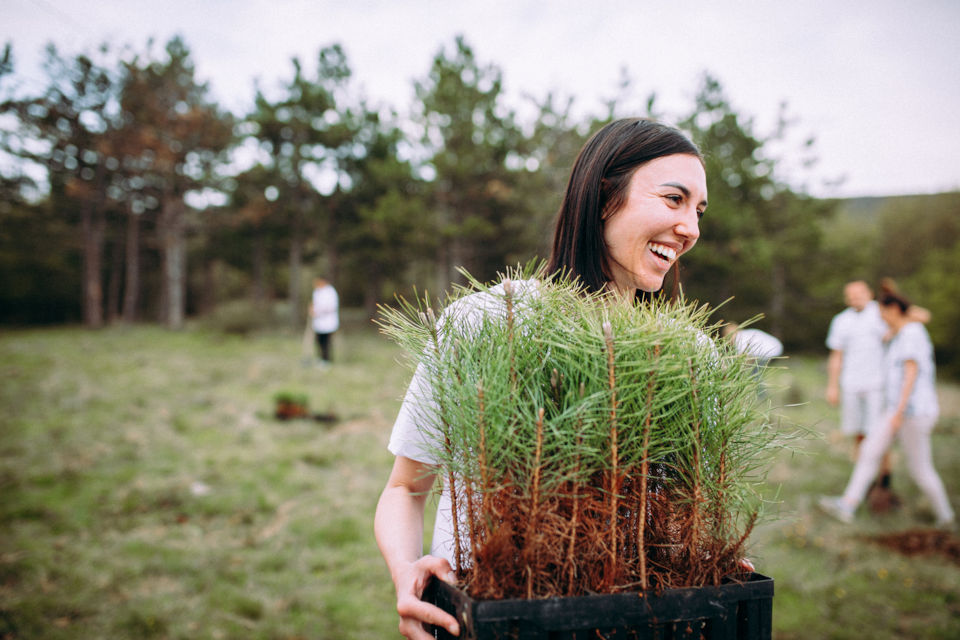 Community - woman planting trees